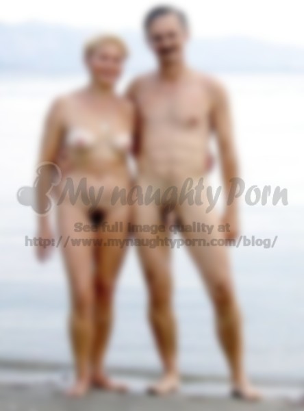 Naughty Nudist Couple - Older couple on a beach posing nude with woman's big hairy ...