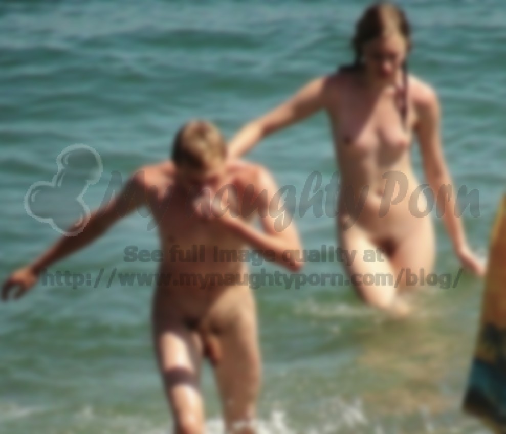 Young naturist couple swimming nude and showing boy's big fat long hairy  uncut dick and girl with firm tits and big bush